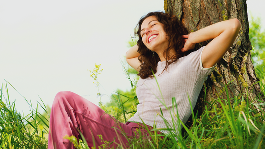 woman meditating under the tree