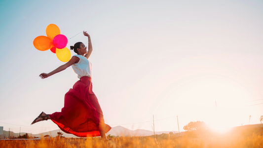 woman holding balloons