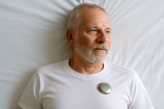 Older man with metal implant lying on a white sheet, calm expression, soft lighting, close-up.