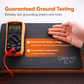 Digital multimeter on a grounding mat with a hand touching it, demonstrating ground testing.