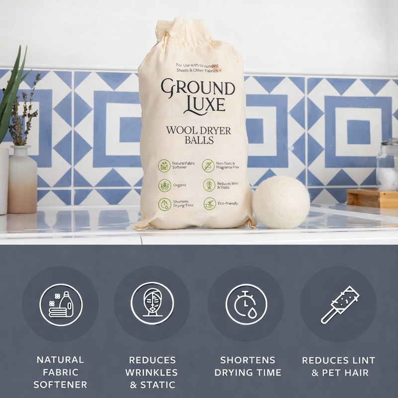 Ground Luxe wool dryer balls with packaging on a bathroom counter

