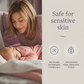 Woman and baby in bed with text about product safety for sensitive skin

