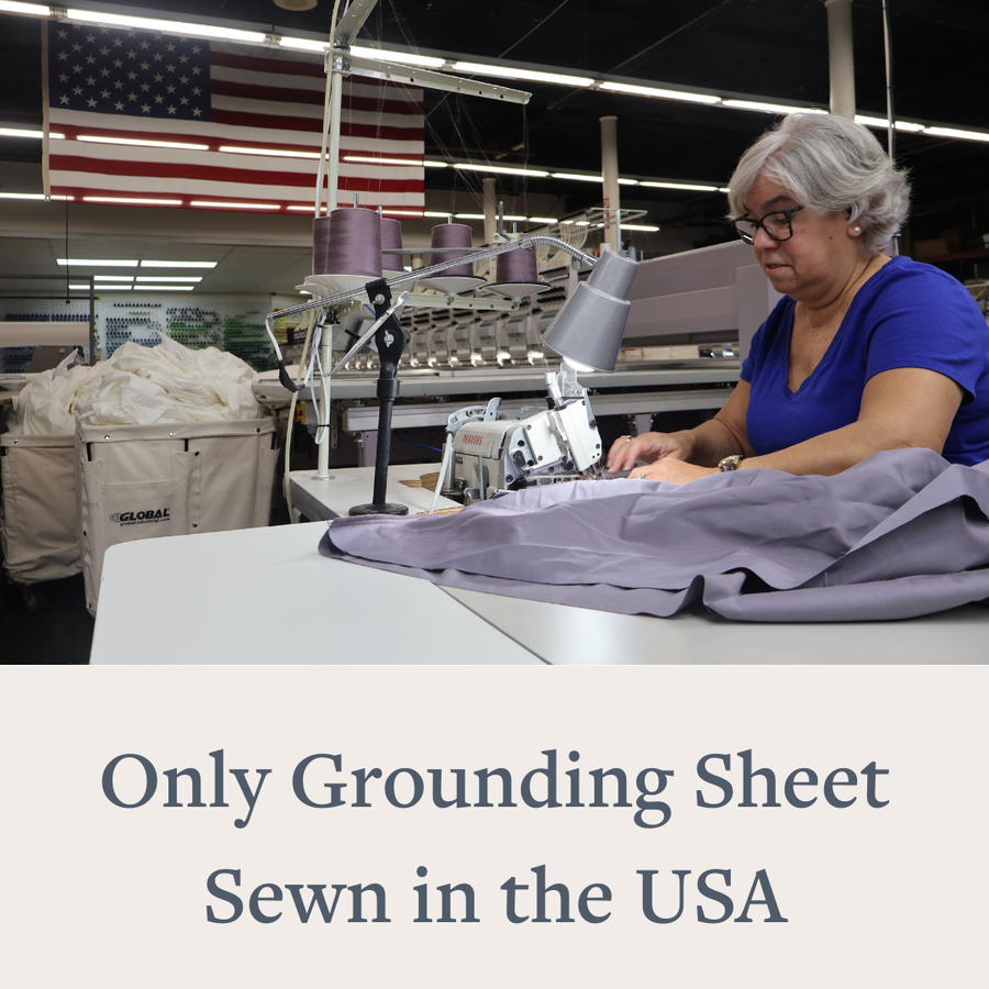 Seamstress sewing a GroundLuxe sheet in the Fall River factory