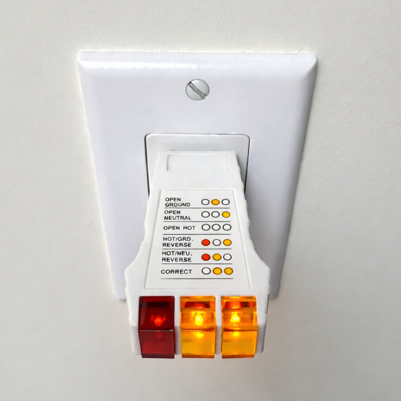 Electrical outlet tester with LED indicators on a white background

