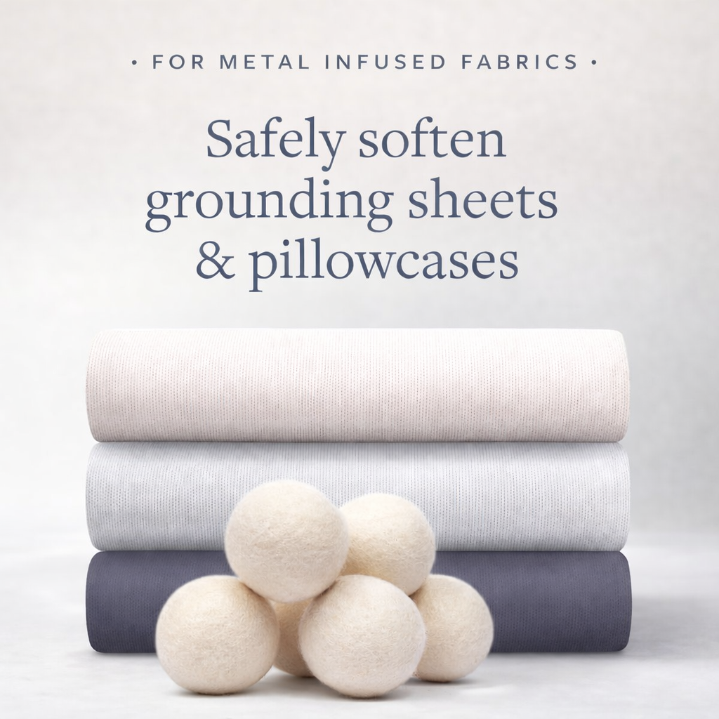Stack of neatly folded bedding sheets and pillowcases with text about metal-infused fabrics on a light gray background.

