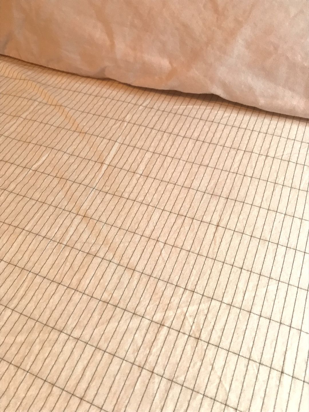 Grounding bed sheet laid flat with visible conductive silver threading