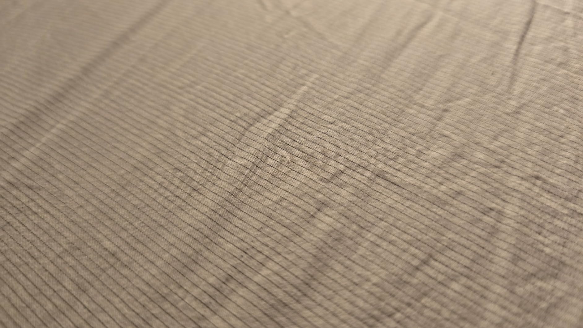 Close-up of conductive fabric from GroundLuxe grounding sheet used for hot flash relief